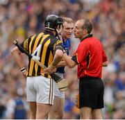 19 August 2012; Referee Cathal McAllister speaks to Lar Corbett, Tipperary, and Kilkenny's Jackie Tyrrell early in the game. GAA Hurling All-Ireland Senior Championship Semi-Final, Kilkenny v Tipperary, Croke Park, Dublin. Picture credit: Ray McManus / SPORTSFILE