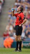 19 August 2012; Referee Cathal McAllister enjoys a drink of water during the first half. GAA Hurling All-Ireland Senior Championship Semi-Final, Kilkenny v Tipperary, Croke Park, Dublin. Picture credit: Ray McManus / SPORTSFILE