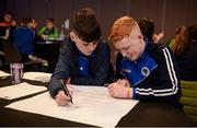 28 October 2017; Bréandán Hollywood, left, age 14, and Adam Markey, age 14, representing Dromintee GAA Club, Co Armagh, fill out their food pyramid during the #GAAyouth Forum 2017 at Croke Park in Dublin. Photo by Cody Glenn/Sportsfile