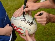23 August 2012; Leinster's Jonathan Sexton and Rob Kearney autograph a rugby ball during the VW Leinster Rugby Summer Camps at De La Salle Palmerston RFC. De La Salle Palmerston RFC, Kilternan,  Co. Dublin. Picture credit: Pat Murphy / SPORTSFILE