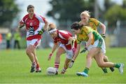 25 August 2012; Valerie Mulcahy, Cork, with support from team-mate Laura McMahon, in action against Kelly Wilson, second from right, and Emer Gallagher, right, Donegal. TG4 All-Ireland Ladies Football Senior Championship Quarter-Final, Cork v Donegal, Dr. Hyde Park, Co. Roscommon. Picture credit: Barry Cregg / SPORTSFILE