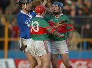 3 November 2002; John Leahy and Pat Croke (10), Mullinahone, tussle with Ger O'Grady (13) and Brendan Carroll, Sarsfields, at the end of the game. Thurles Sarsfields v CJ Kickhams Mullinahone, Tipperary County Senior Hurling Championship Final, Thurles, Co. Tipperary. Picture credit; Matt Browne / SPORTSFILE *EDI*