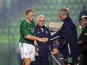 20 November 2002; Glen Crowe, Republic of Ireland, with Billy Young to his left, is congratulated by caretaker manager Don Givens after he was substituted during the second half. International friendly, Greece v Republic of Ireland, Panathinakos Stadium, Athens, Greece. Soccer. Picture credit; David Maher / SPORTSFILE *EDI*
