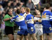 24 November 2002; Referee Brian Crowe comes between Darren Crozier, (5), Ballinderry and Peter Loughran, Errigal Ciaran. Errigal Ciaran v Ballinderry, Ulster Club Semi Final, St Tighearnachs Park, Clones, Co. Monaghan. Football. Picture credit; Damien Eagers / SPORTSFILE *EDI*
