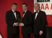 29 November 2002; Kieran McGeeney, Armagh, is presented with his All-Star award by GAA President Sean McCague and Paul Donovan, Chief Executive, Vodafone, at the VODAFONE GAA All-Star Awards in the Citywest Hotel, Dublin. Football. Hurling. Picture credit; Brendan Moran / SPORTSFILE *EDI*