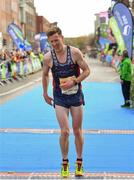 29 October 2017; Killian Nolan of Piranha Triathlon Club, Co Dublin, crosses the finish line during the SSE Airtricity Dublin Marathon 2017 at Merrion Square in Dublin City. 20,000 runners took to the Fitzwilliam Square start line to participate in the 38th running of the SSE Airtricity Dublin Marathon, making it the fifth largest marathon in Europe. Photo by Sam Barnes/Sportsfile