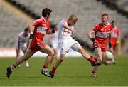 30 June 2012; Kieran McGeary, Tyrone, in action against James Kearney, Derry. Electric Ireland Ulster GAA Football Minor Championship Semi-Final, Derry v Tyrone, St Tiernach's Park, Clones, Co. Monaghan. Picture credit: Oliver McVeigh / SPORTSFILE