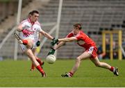 30 June 2012; Anthony Devlin, Tyrone, in action against Gareth McKinless, Derry. Electric Ireland Ulster GAA Football Minor Championship Semi-Final, Derry v Tyrone, St Tiernach's Park, Clones, Co. Monaghan. Picture credit: Oliver McVeigh / SPORTSFILE
