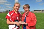 25 August 2012; Nollaig Cleary, Cork, is presented with the Player of the Match Award by President of Connacht Ladies Football Kathleen Kane. TG4 All-Ireland Ladies Football Senior Championship Quarter-Final, Cork v Donegal, Dr. Hyde Park, Co. Roscommon. Picture credit: Barry Cregg / SPORTSFILE