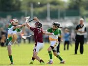 26 August 2012; Shane Quike, Athenry, Co. Galway, in action against Killian Sampson, left, and Dara Maher, Shinrone and Coolderry, Co. Offaly, competing in the Hurling Boy's U-11 event. Community Games National Finals Weekend, Athlone, Co. Westmeath. Picture credit: David Maher / SPORTSFILE