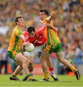 26 August 2012; Donncha O'Connor, Cork, in action against Leo McLoone, left, and David Walsh, Donegal. GAA Football All-Ireland Senior Championship Semi-Final, Cork v Donegal, Croke Park, Dublin. Picture credit: Ray McManus / SPORTSFILE