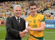 26 August 2012; Cillian O'Sullivan, Meath, is presented with his Electric Ireland Man of the Match Award by Sean Walsh, Electric Ireland. Croke Park, Dublin. Picture credit: Ray McManus / SPORTSFILE