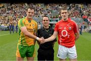 26 August 2012; The Donegal captain Michael Murphy and Cork captain Graham Canty shake hands across referee David Coldrick. GAA Football All-Ireland Senior Championship Semi-Final, Cork v Donegal, Croke Park, Dublin. Picture credit: Ray McManus / SPORTSFILE