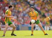 26 August 2012; Donegal corner back Paddy McGrath hand passes to team mate Patrick McBrearty. GAA Football All-Ireland Senior Championship Semi-Final, Cork v Donegal, Croke Park, Dublin. Picture credit: Ray McManus / SPORTSFILE