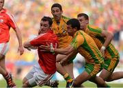 26 August 2012; Donnacha O'Connor, Cork, in action against Frank McGlynn, Rory Kavanagh and Eamonn McGee, Donegal. GAA Football All-Ireland Senior Championship Semi-Final, Cork v Donegal, Croke Park, Dublin. Picture credit: Oliver McVeigh / SPORTSFILE