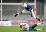 31 August 2012; Kyle McKinnon, Kent School, clears the attempted tackle of Sam Fossey, National School of American Football. Global Ireland Football Tournament 2012, Kent School, Connecticut, v National School of American Football, Ireland/UK, Parnell Park, Dublin. Picture credit: Brendan Moran / SPORTSFILE