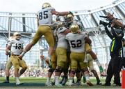 1 September 2012; Notre Dame's Tyler Eifert, second from right, is held aloft by team-mates after scoring a touchdown. NCAA Emerald Isle Classic, Navy v Notre Dame, Aviva Stadium, Lansdowne Road, Dublin. Picture credit: Pat Murphy / SPORTSFILE