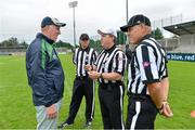 31 August 2012; Brian Mullins, left, former Dublin footballer and Director of Sport at UCD, meets with the match officials before the game. Global Ireland Football Tournament 2012, Kent School, Northwestern Connecticut v National School of American Football, Ireland/UK. Parnell Park, Dublin. Picture credit: Brendan Moran / SPORTSFILE