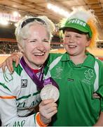 2 September 2012; Ireland's Catherine Walsh, from Swords, Dublin, with her daughter Alison Roode, age 8, celebrate with her silver medal after finishing in second place in the women's individual B pursuit final. London 2012 Paralympic Games, Cycling, Velodrome, Olympic Park, Stratford, London, England. Picture credit: Brian Lawless / SPORTSFILE