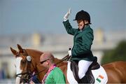 3 September 2012; Ireland's Eilish Byrne, from Dundalk, Co. Louth, aboard Youri, waves to the crowd having competed in the individual freestyle test - grade II. London 2012 Paralympic Games, Equestrian, Greenwich Park, Greenwich, London, England. Picture credit: Brian Lawless / SPORTSFILE