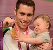 3 September 2012; Team Ireland's Jason Smyth, from Eglinton, Co. Derry, men's 100m - T13 gold medal winner, along with his 6 month old nephew Lewis D'hulst, at the team lodge. London 2012 Paralympic Games, Team Lodge, Stratford, London, England. Picture credit: Brian Lawless / SPORTSFILE
