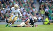 1 September 2012; Navy wide receiver Casey Bolena fumbles a pass under pressure from Notre Dame's Chris Brown. NCAA Emerald Isle Classic, Navy v Notre Dame, Aviva Stadium, Lansdowne Road, Dublin. Picture credit: Brendan Moran / SPORTSFILE