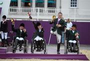 4 September 2012; Ireland's equestrian team, from left, Geraldine Savage, from Dublin, Helen Kearney, from Dunlaven, Co. Wicklow, James Dwyer, from Mooncoin, Co. Kilkenny, and Eilish Byrne, from Dundalk, Co. Louth, celebrate with their bronze medals in the equestrian team championship. London 2012 Paralympic Games, Equestrian, Greenwich Park, Greenwich, London, England. Picture credit: Brian Lawless / SPORTSFILE