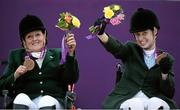 4 September 2012; Ireland's equestrian team Geraldine Savage, left, from Dublin, and Helen Kearney, from Dunlaven, Co. Wicklow, celebrate with their bronze medals in the equestrian team championship. London 2012 Paralympic Games, Equestrian, Greenwich Park, Greenwich, London, England. Picture credit: Brian Lawless / SPORTSFILE
