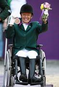 4 September 2012; Ireland's Eilish Byrne, from Dundalk, Co. Louth, celebrates with her bronze medal in the equestrian team championship. London 2012 Paralympic Games, Equestrian, Greenwich Park, Greenwich, London, England. Picture credit: Brian Lawless / SPORTSFILE