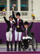 4 September 2012; Ireland's Helen Kearney, from Dunlaven, Co. Wicklow, right, who won a bronze medal in the dressage individual freestyle test - Grade Ia, with gold medal winner Sophie Christiansen, Great Britain, centre, and silver medallist Laurentia Tan, Singapore. London 2012 Paralympic Games, Equestrian, Greenwich Park, Greenwich, London, England. Picture credit: Brian Lawless / SPORTSFILE