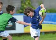 23 August 2012; Brian Gaffney, age 9, from Clontarf, in action against Christopher Hamill, from Clontarf, during the VW Leinster Rugby Summer Camps at Clontarf RFC. Clontarf RFC, Castle Avenue, Clontarf, Dublin. Picture credit: Brian Lawless / SPORTSFILE