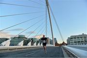 6 September 2012; Mark Kenneally, Garda Athletic Club, makes his way across the Samuel Beckett Bridge on his way to winning the Grant Thornton Corporate 5k Team Challenge. Docklands, Dublin. Picture credit: Barry Cregg / SPORTSFILE
