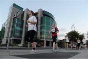 6 September 2012; Maggie Walsh, CPL Team 3, left, and Niamh Sterling, Mixed Shades of Grey - Lynch Interact, competing in the Grant Thornton Corporate 5k Team Challenge. Docklands, Dublin. Picture credit: Pat Murphy / SPORTSFILE