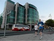 6 September 2012; Declan Galwey, Road Runner, 1239, runs alongside Thomas Farrell, Tri Mna Go Fear, left, during the Grant Thornton Corporate 5k Team Challenge. CHQ Building, Docklands, Dublin. Picture credit: Pat Murphy / SPORTSFILE