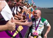 7 September 2012; Ireland's Mark Rohan, from Ballinahown, Co. Westmeath, is congratulated by members of the crowd after the men's individual H 1 road race. London 2012 Paralympic Games, Cycling, Brands Hatch, Kent, England. Picture credit: Brian Lawless / SPORTSFILE