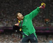 7 September 2012; Ireland's Jason Smyth, from Eglinton, Co. Derry, celebrates with his gold medal after the men's 200m - T13 final. London 2012 Paralympic Games, Athletics, Olympic Stadium, Olympic Park, Stratford, London, England. Picture credit: Brian Lawless / SPORTSFILE