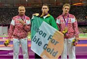 7 September 2012; Winner of the men's 200m - T13 final Ireland's Jason Smyth, from Eglinton, Co. Derry, along with silver medallist Alexey Labzin, left, Russian Federation, and bronze medallist Artem Loginov, right, Russian Federation, on the podium after the men's 200m - T13 medal presentations. London 2012 Paralympic Games, Athletics, Olympic Stadium, Olympic Park, Stratford, London, England. Picture credit: Brian Lawless / SPORTSFILE