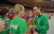 7 September 2012; Ireland's Jason Smyth, from Eglinton, Co. Derry, celebrates with his fiance Elisa Jordan and mother Diane Smyth, left, after winning gold in the men's 200m - T13 final. London 2012 Paralympic Games, Athletics, Olympic Stadium, Olympic Park, Stratford, London, England. Picture credit: Brian Lawless / SPORTSFILE