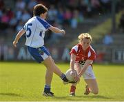 8 September 2012; Briege Burke, Cork, blocks a kick from Cora Courtney, Monaghan. TG4 All-Ireland Ladies Football Senior Championship Semi-Final, Cork v Monaghan, St. Brendan’s Park, Birr, Co. Offaly. Picture credit: Barry Cregg / SPORTSFILE
