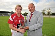 8 September 2012; Briege Corkery, Cork, is presented with the player of the match award by Pat Quill, President, Ladies Gaelic Football Association. TG4 All-Ireland Ladies Football Senior Championship Semi-Final, Cork v Monaghan, St. Brendan’s Park, Birr, Co. Offaly. Picture credit: Barry Cregg / SPORTSFILE