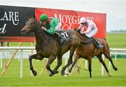 9 September 2012; Tarana, with Niall McCullagh up, leads Bronte, with Billy Lee up, on their way to winning the Moyglare 50 European Breeders Fund Fillies Maiden. Curragh Racecourse, the Curragh, Co. Kildare. Picture credit: Barry Cregg / SPORTSFILE