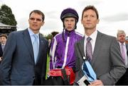 9 September 2012; Jockey Joseph O'Brien, centre, with his father and trainer Aiden, left, alongside Paul Smith, watch the race reply on the big screen after he rode Up to win the Irresistible Jewel Blandford Stakes. Curragh Racecourse, the Curragh, Co. Kildare. Picture credit: Barry Cregg / SPORTSFILE