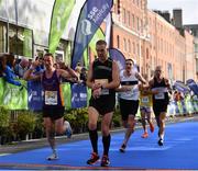 29 October 2017; Runners cross the finish line during the SSE Airtricity Dublin Marathon 2017 at Merrion Square in Dublin City. 20,000 runners took to the Fitzwilliam Square start line to participate in the 38th running of the SSE Airtricity Dublin Marathon, making it the fifth largest marathon in Europe. Photo by Sam Barnes/Sportsfile