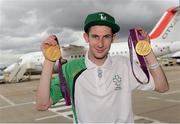 10 September 2012; Team Ireland's Michael McKillop, from Newtownabbey, Co. Antrim, gold medal, 1500m -T37 and 800m -T37, pictured with his two gold medals prior to departure for Dublin. London 2012 Paralympic Games, Team Ireland Athletes Prepare for Departure, London City Airport, London, England. Picture credit: Brian Lawless / SPORTSFILE