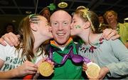 10 September 2012; Double gold medal cyclist Mark Rohan, from Ballinahown, Co. Westmeath, receives a kiss from his cousins Eva, left, age 10, and Kate Rohan, age 8, Ballinahown, Co. Westmeath, on his arrival home from the London 2012 Paralympic Games. Dublin Airport, Dublin. Photo by Sportsfile