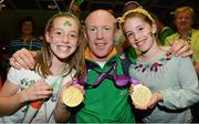 10 September 2012; Double gold medal cyclist Mark Rohan, from Ballinahown, Co. Westmeath, with his cousins Eva, left, age 10, and Kate Rohan, age 8, Ballinahown, Co. Westmeath, on his arrival home from the London 2012 Paralympic Games. Dublin Airport, Dublin. Photo by Sportsfile