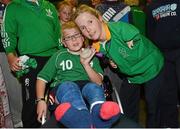 10 September 2012; Team Ireland's Catherine O'Neill, from New Ross, Co. Wexford, silver medal, discus throw -T51 with Shane Barker, age 9, from Donabate, Co. Dublin, on her arrival home from the London 2012 Paralympic Games. Dublin Airport, Dublin. Photo by Sportsfile
