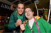 10 September 2012; Team Ireland's Padraic Moran from Bray, Co. Wicklow, pictured with Olympic boxer Darren O'Neill on his arrival home from the London 2012 Paralympic Games. Dublin Airport, Dublin. Photo by Sportsfile