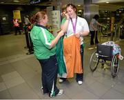 10 September 2012; Team Ireland's Orla Barry, from Ladysbridge, Co. Cork, bronze medal, women's discus throw F57/58, with Maria Furlong, daughter of Pat Furlong athletics coach, left, pictured on her arrival home from the London 2012 Paralympic Games. Dublin Airport, Dublin. Picture credit: Brian Lawless / SPORTSFILE