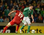 11 September 2012; Kyle Lafferty, Northern Ireland, in action against Mathias Janisch, Luxembourg. 2014 FIFA World Cup Qualifier Group F, Northern Ireland v Luxembourg, Windsor Park, Belfast, Co. Antrim. Picture credit: Oliver McVeigh / SPORTSFILE